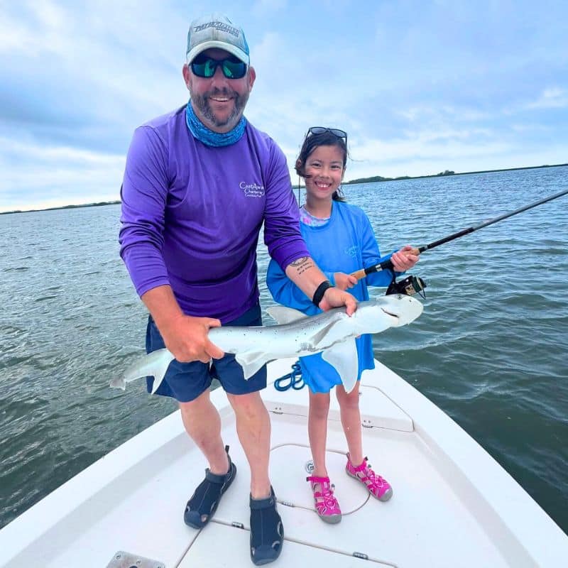 Man holding fish on boat during Beaufort SC fishing charter