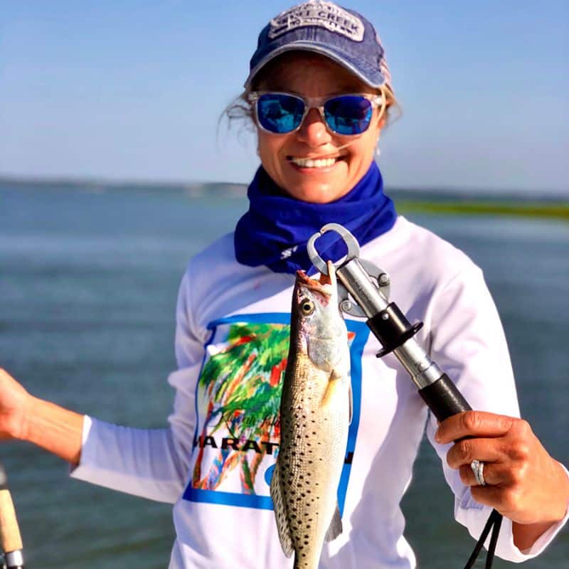 Young angler holding fish on Cast Away fishing and boating charters in Beaufort SC