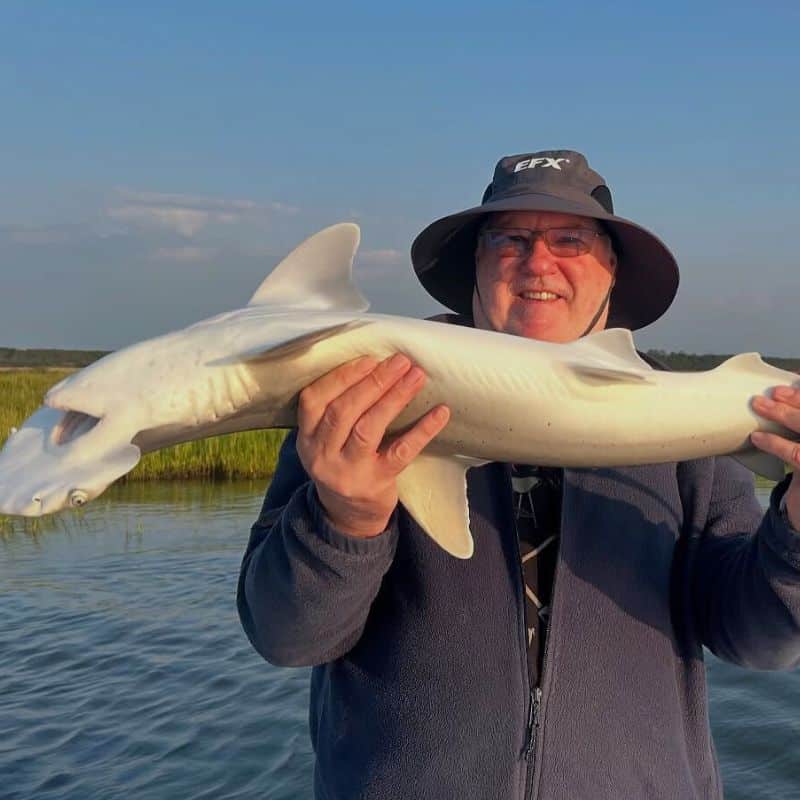 Angler holding fish on Cast Away fishing and boating charter