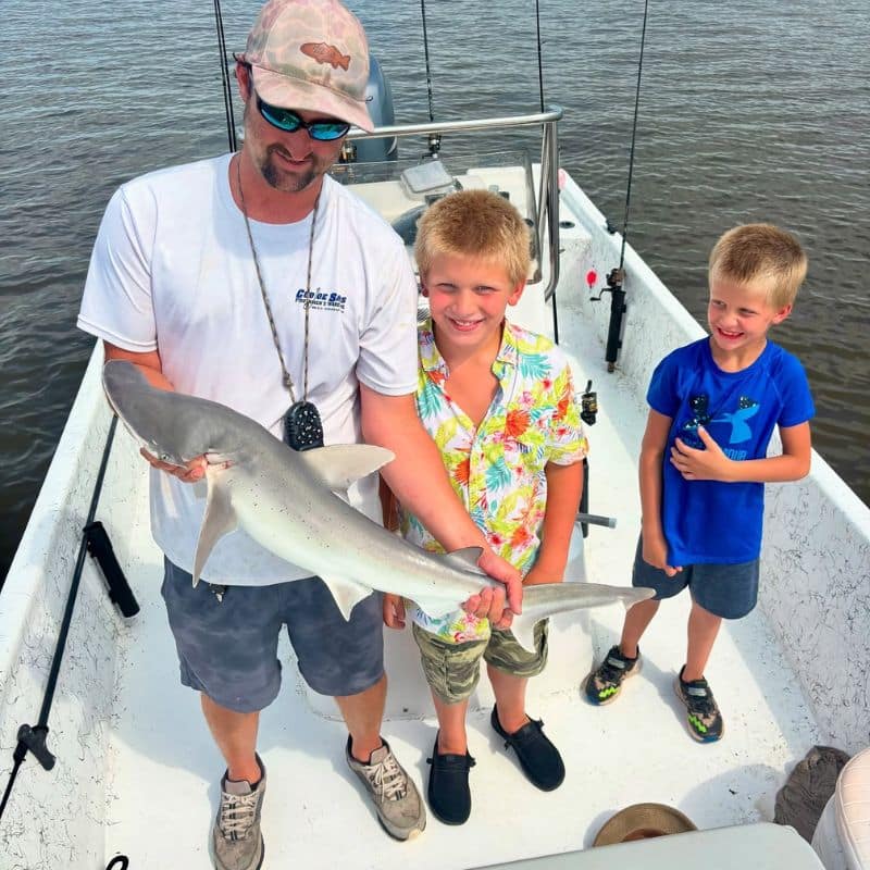 Group holding catch on Cast Away fishing and boating charter