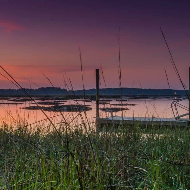 Lowcountry sunset over water during Beaufort SC boat charter