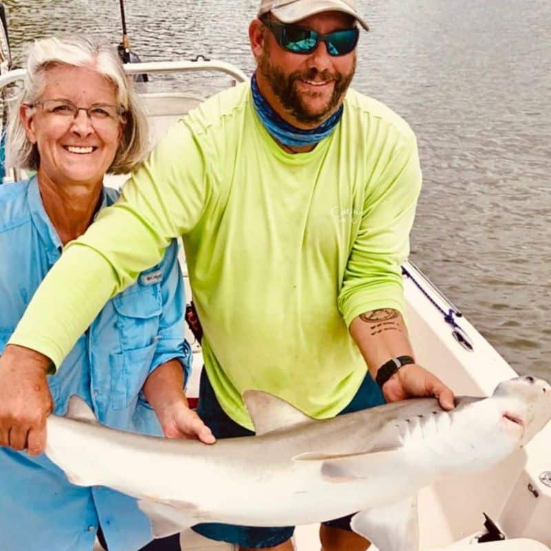 Group holding catch on Lowcountry fishing charter near Harbor Island